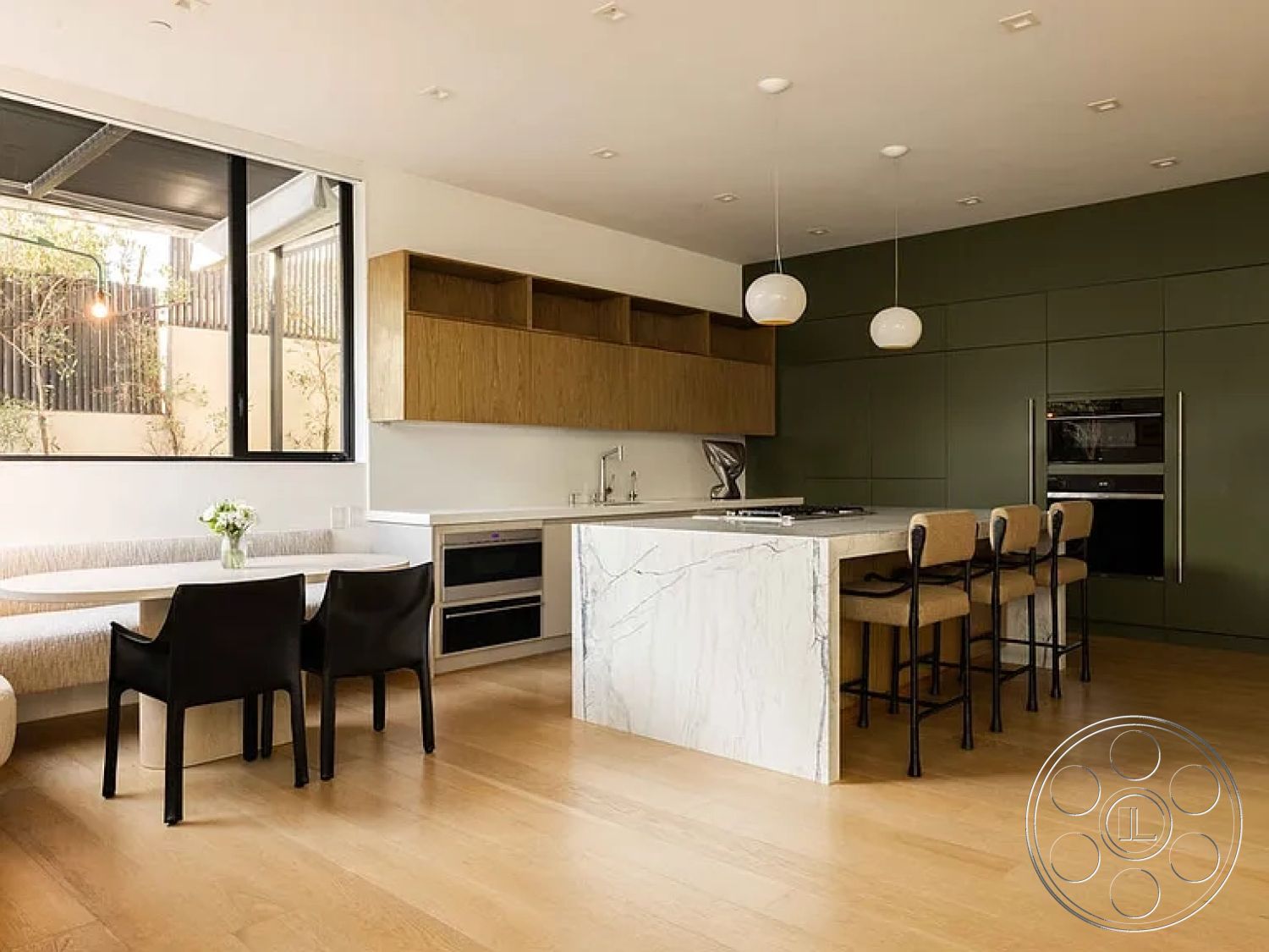 Modern 512 - neutral color palette, light hardwood flooring, open floor plan, modern pendant lighting, large windows for natural light, textured wall finish, green accent wall, contemporary kitchen appliances, modern bar stools, interior kitchen design, marble kitchen island countertop, minimalist dining area, wood cabinetry with open shelves, large cooktop with integrated ventilation, built-in oven with stainless steel finish, seating area with upholstered bench, organically styled interior, natural light-focused layout