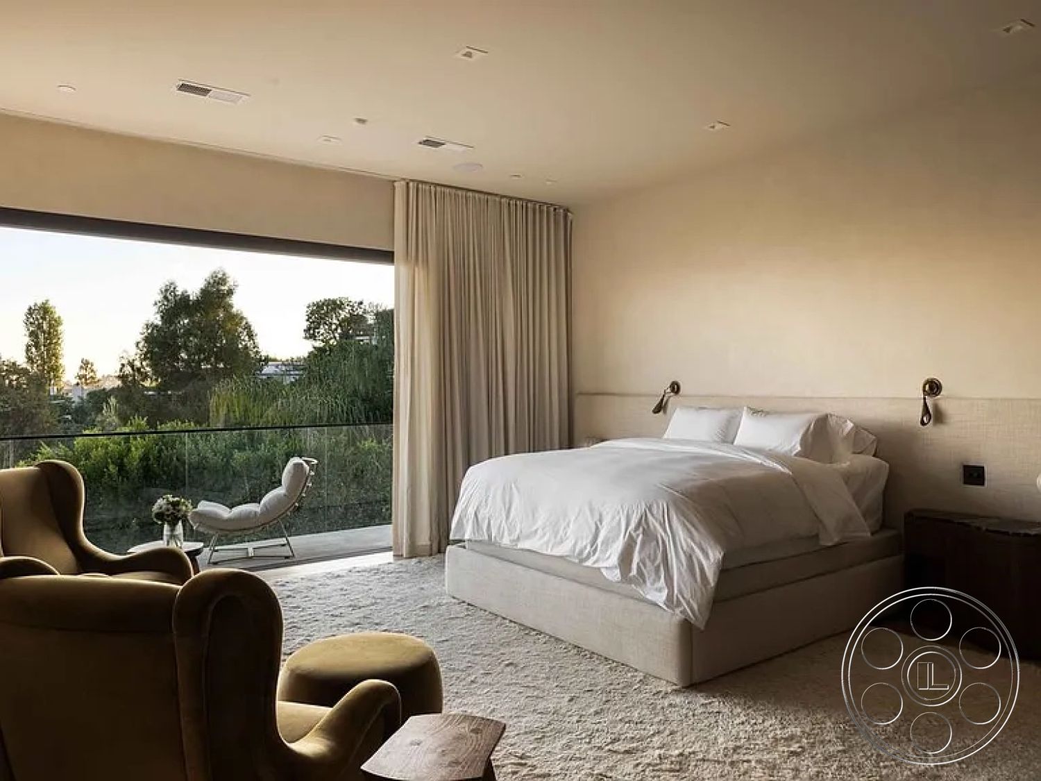 Modern 512 - minimalist decor, neutral color palette, natural light, contemporary style, landscape view, floor-to-ceiling windows, soft area rug, white bedding, textured plaster walls, interior bedroom, curved armchair, large sliding glass door, beige upholstered bed frame, curtains draping, wood side table