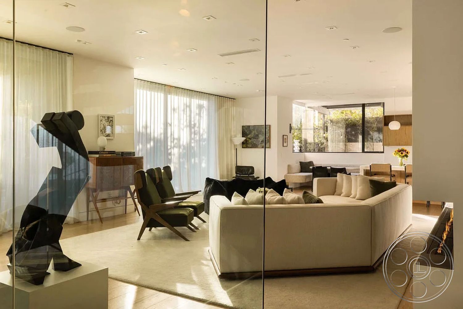 Modern 512 - neutral color palette, textured area rug, contemporary design elements, large floor-to-ceiling windows, minimalist pendant lighting, modern sectional sofa, open floor plan living area, glass partition wall, sunny urban setting, dark wood accent furniture, soft fabric throw pillows, interior concreate flooring, light wooden accent walls, sculptural art piece, black modern accent chair, indoor plant decoration