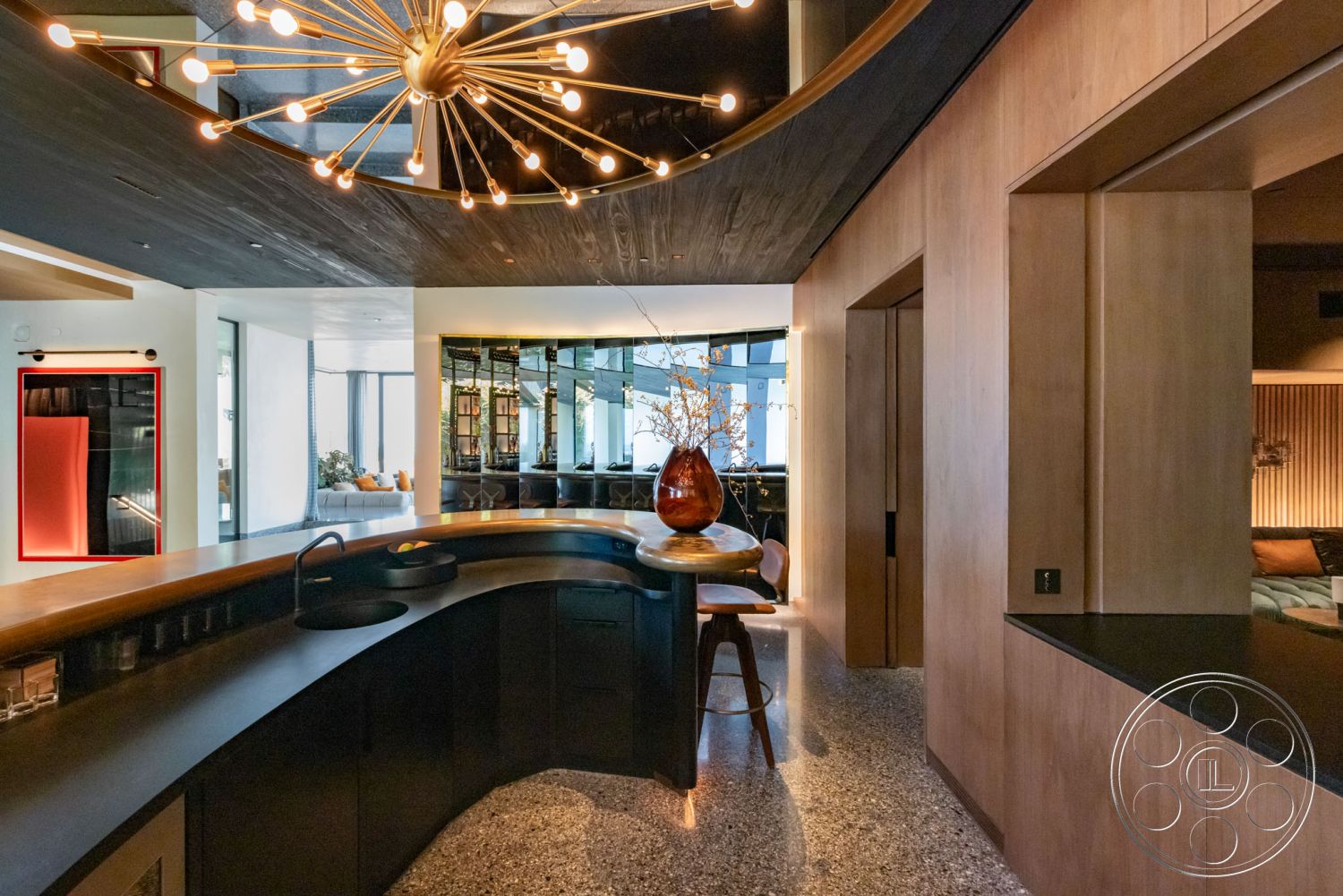 Modern 513 - minimalist decor, terrazzo flooring, modern lighting fixtures, open concept layout, floor-to-ceiling windows, black cabinetry, seamless indoor-outdoor flow, harmonious color palette, warm wood accents, wood beam ceiling, contemporary style kitchen, curved wooden bar countertop, reflective wall mirrors, textured wood wall panels, sitting area with views, crafted furniture details, original art pieces