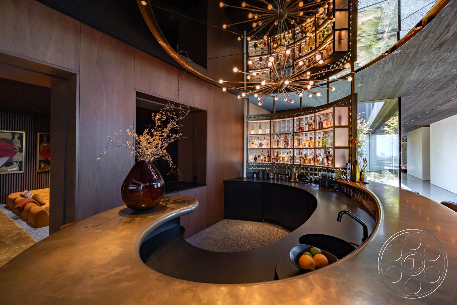 Modern 513 - minimalist decor, open floor plan, modern pendant lighting, stone flooring, suspended ceiling, dark wood paneling, contemporary architectural details, interior bar area, textured plaster wall accents, large panoramic windows, luxury home bar, polished concrete countertop, curved bar design, backlit glass display shelves, bottle display wall, seamless glass partition, strategic indoor lighting, elegant bar seating, high-end interior design