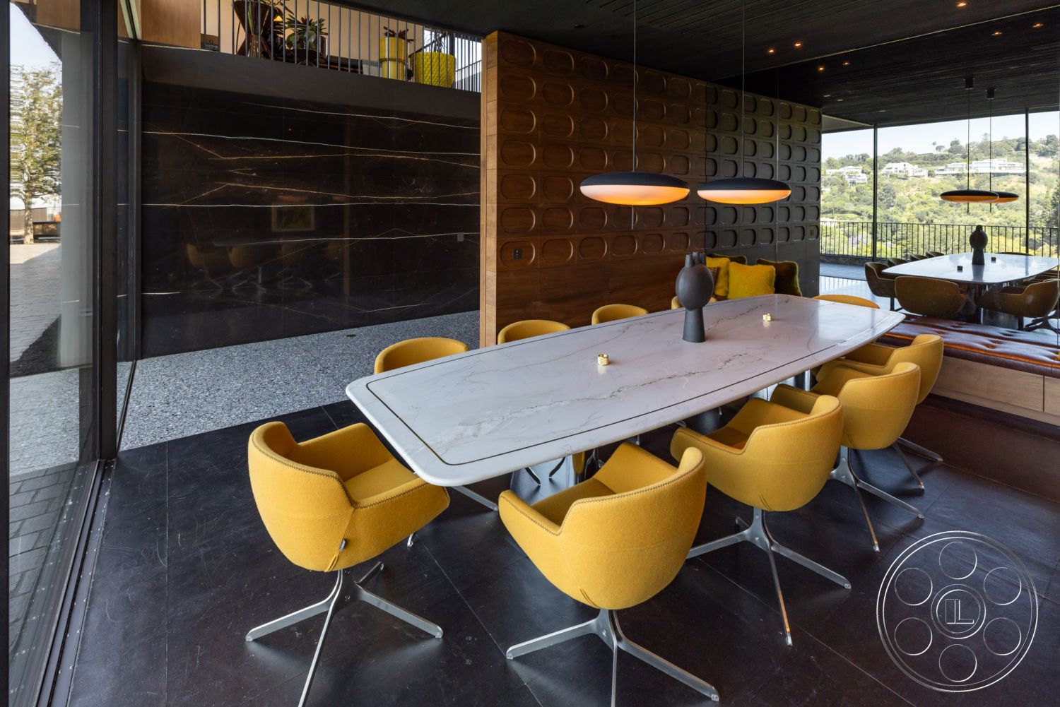 Modern 513 - interior modern pendant lighting, interior large glass windows, interior polished concrete flooring, interior minimalist design elements, interior marble dining table, interior seamless indoor-outdoor transition, interior contemporary design style, interior wooden accent wall, interior yellow upholstered dining chairs, interior black stone feature wall, interior open dining area, interior unusual geometric shapes, interior sleek modern furniture, interior scenic hillside view