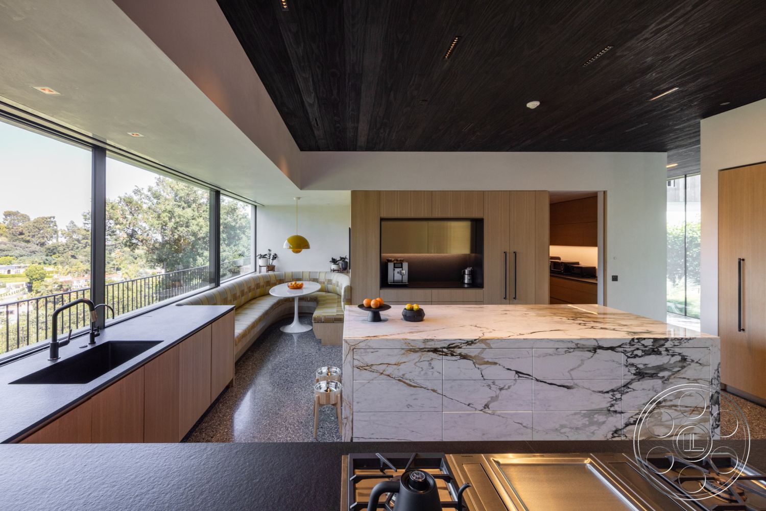 Modern 513 - terrazzo flooring, wood cabinetry, modern pendant lighting, floor-to-ceiling windows, integrated appliances, open-concept layout, natural light-filled space, minimalist kitchen design, black granite kitchen countertop, marble kitchen island, textured wood ceiling paneling, L-shaped kitchen design, curved sofa seating, panoramic view of greenery