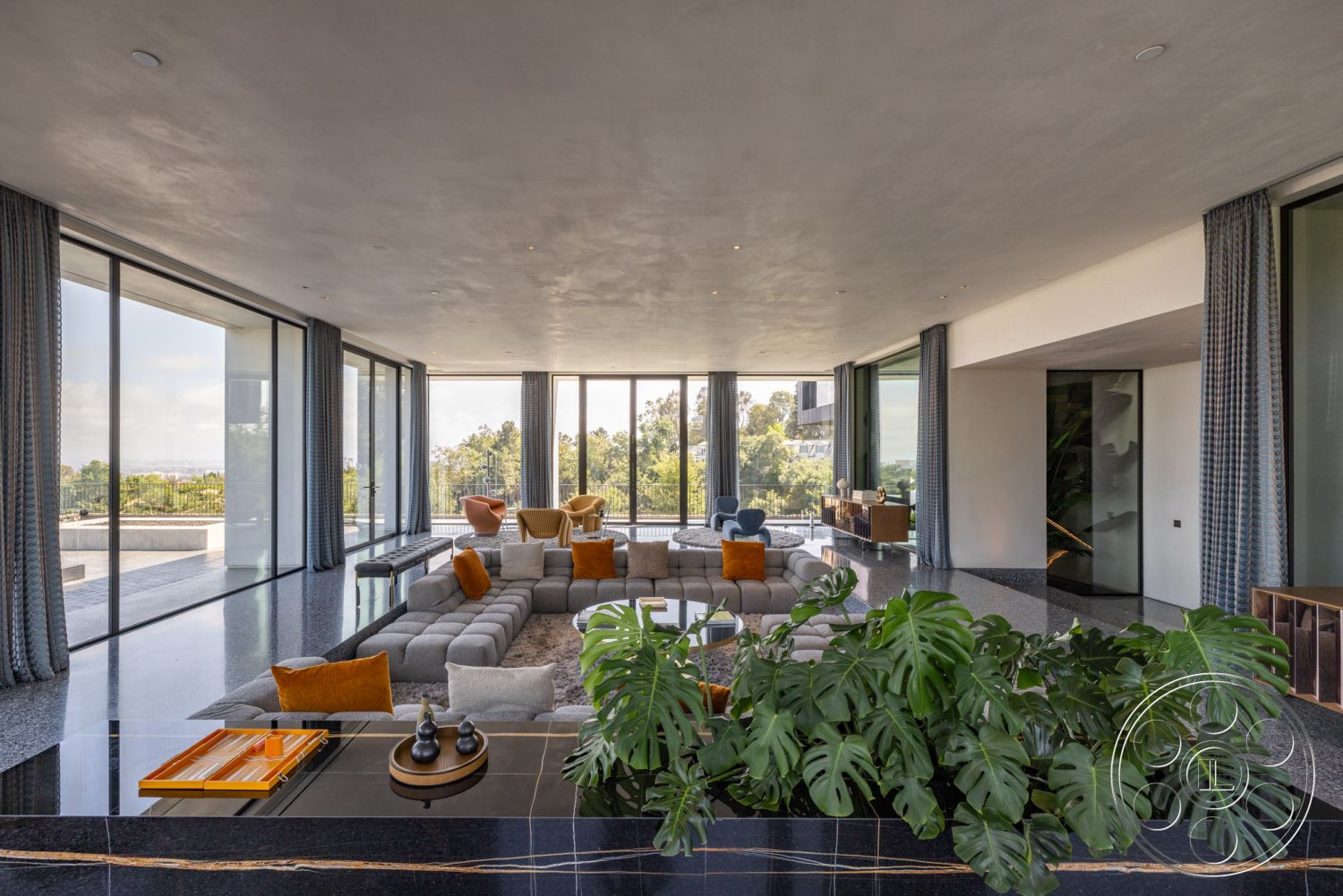 Modern 513 - polished concrete flooring, modern light fixtures, glass sliding doors, floor-to-ceiling windows, contemporary furnishings, gray sectional sofa, textured wall treatment, luxury interior design, minimalist decor style, interior open floor plan, natural light-filled living space, decorative orange throw pillows, raw concrete ceiling finish, black marble kitchen island, metallic cabinet hardware, indoor plants with large leaves, wooden sideboard with clean lines, curved sectional sofa layout, outdoor terrace access