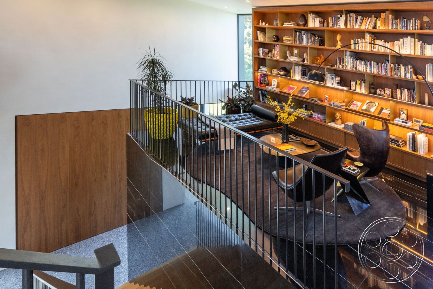 Modern 513 - textured wall accents, floor-to-ceiling windows, soft neutral wall colors, stylish coffee table, black marble flooring, modern lounge area, designer lighting fixtures, indoor plant decor, floating staircase, yellow planter, exposed wood ceiling beams, interior living space, minimalist interior design, curved area rug, wood paneling wall treatment, contemporary armchairs, open shelving library wall, dark hardwood staircase, urban modern home, library nook