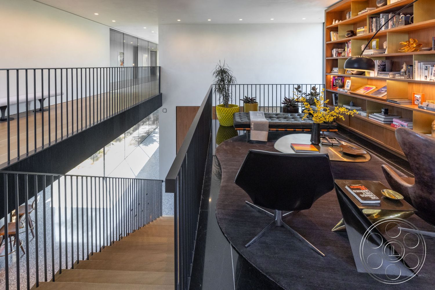 Modern 513 - neutral wall colors, polished concrete flooring, modern lighting fixtures, textured wall surfaces, open concept living space, natural light-filled space, contemporary furniture style, modernist architectural style, integrated shelving units, open staircase design, interior hardwood staircase, interior concrete floors, exposed black metal railings, geometric table design, custom wood cabinetry, bright yellow accent furniture, minimalist home office area, large glass window facades, sequenced bookshelves