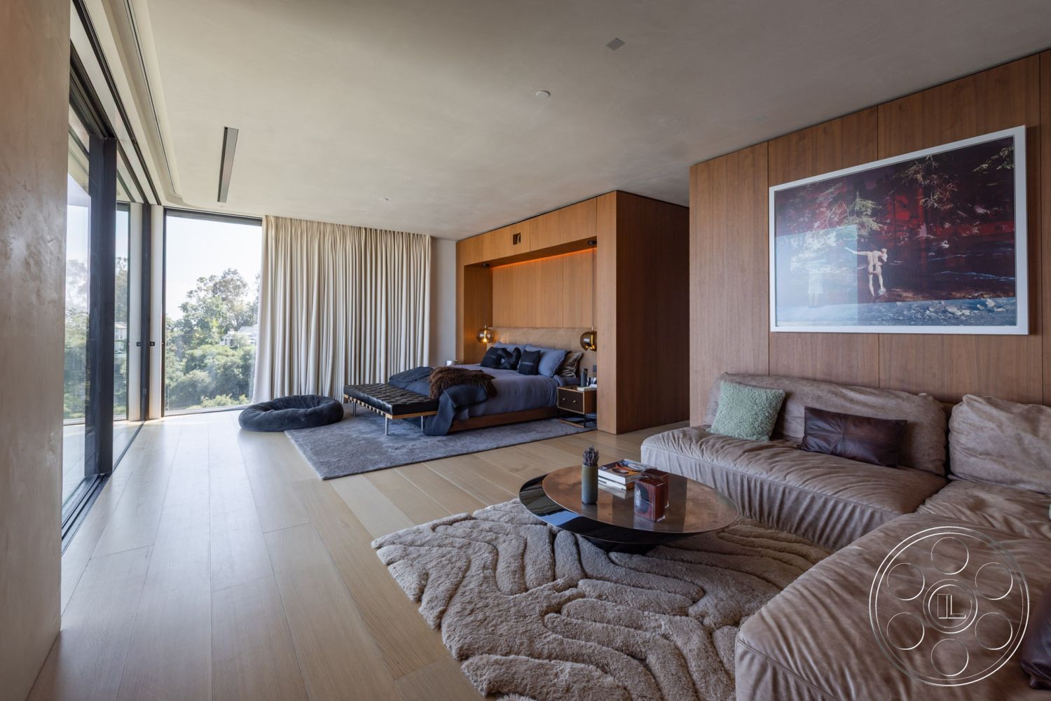 Modern 513 - neutral color palette, round coffee table, floor-to-ceiling windows, textured plaster walls, plush area rug, hardwood living room floors, modern sectional sofa, open floor plan interior, natural light-filled environment, contemporary residential design, views of lush greenery, exposed concrete wall details, custom wood paneling accent wall, soft drapery curtains, minimalist bedroom setup, sleek light fixtures, zen-inspired living space, integrated ambient lighting