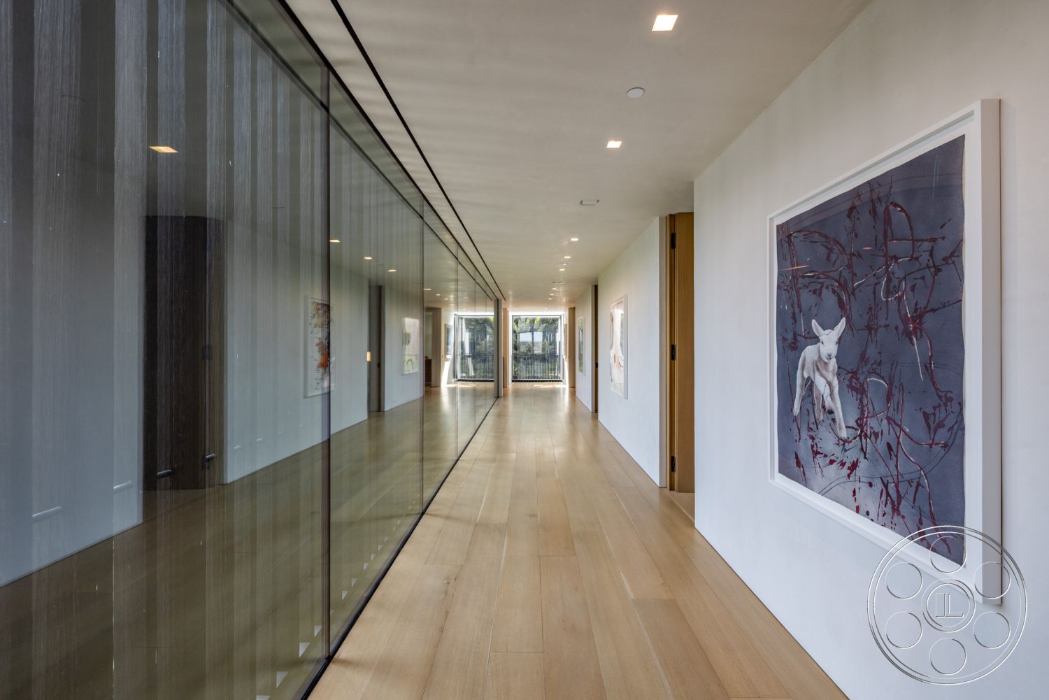 Modern 513 - neutral color palette, large glass sliding door, vaulted ceiling, linear pathway, contemporary architectural style, glass partition walls, interior hallway, modern interior design, integrated indoor-outdoor living, minimalist hallway, hardwood hallway flooring, natural light corridor, artwork display wall, smooth concrete ceiling finish, exposed framing elements, flush LED ceiling lights, open view outdoors, expansive glass façade, frameless glass walls