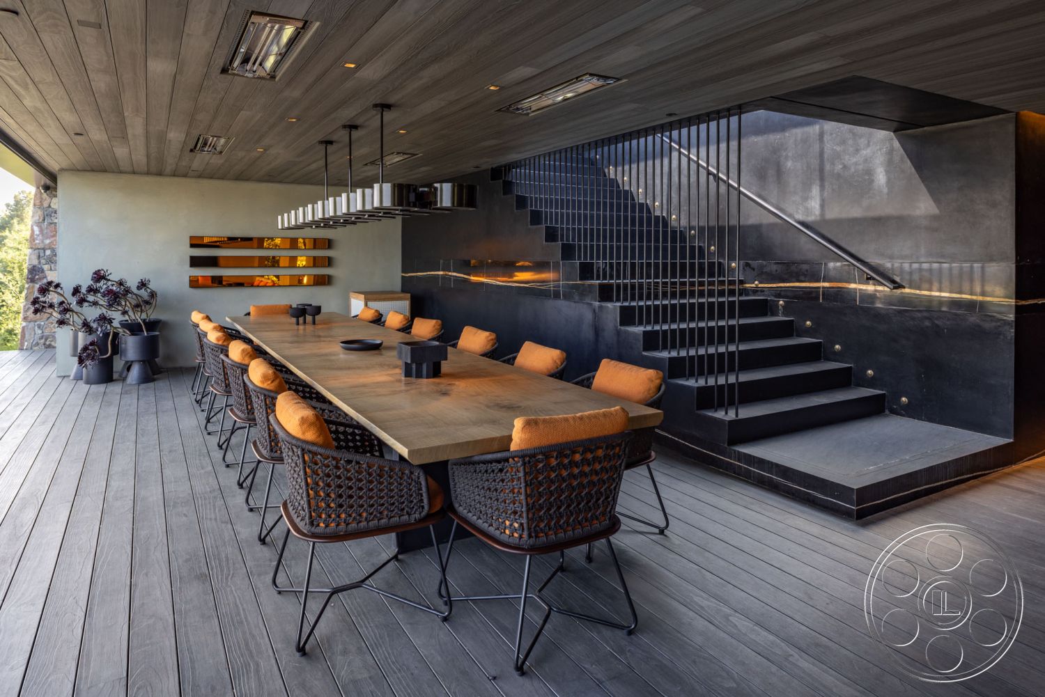 Modern 513 - minimalist decor, open concept layout, modern pendant lighting, industrial style, dark wood flooring, rectangular dining table, gray concrete walls, woven dining chairs, interior dining area, textured plaster wall, glass wall partition, steel stair railings, concrete staircase, wood ceiling planks, accent wall with built-in shelves, exposed mechanical details, city view from dining space