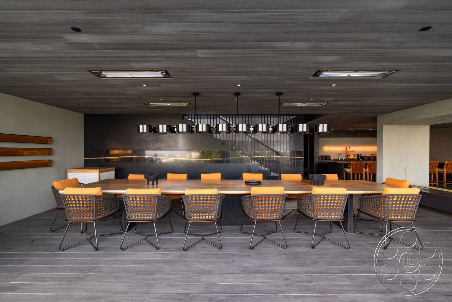 Modern 513 - open concept layout, sliding glass doors, mountain view, modern dining table, textured plaster wall, designer pendant lighting, high ceiling with skylights, minimalist architectural details, exterior dining area, wood clad ceiling, concrete wall accents, woven patio chairs, gray hardwood flooring, urban outdoor terrace, practical outdoor kitchen