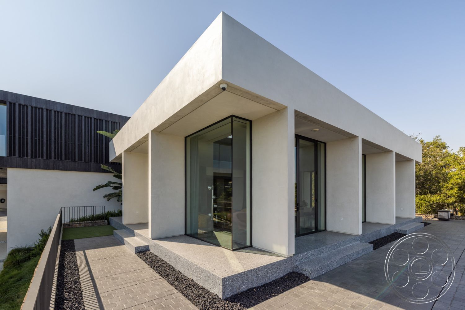 Modern 513 - urban setting, city skyline view, contemporary architectural style, exterior stone patio flooring, outdoor garden area, exterior flat roof design, textured wall details, exterior concrete walls, angular architectural forms, modern outdoor living space, exterior minimalist design elements, exterior steel railing, exterior polished concrete steps, exterior glass window facades, exterior linear landscaping