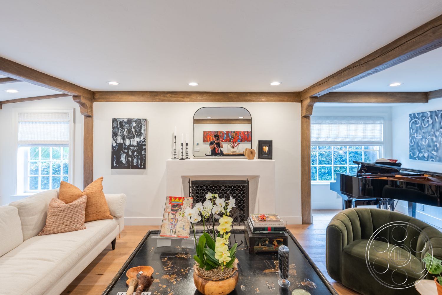 Americana 201 - neutral color palette, glass coffee table, cozy seating arrangement, modern art wall decor, floor-to-ceiling windows, decorative art pieces, elegant dining area, rectangular coffee table, exposed wood ceiling beams, natural light interior, interior hardwood living room floors, white painted walls, open floor plan design, plush decorative pillows, dark wood mantel fireplace, curved green sofa, contemporary home office setup, luxurious living area design, chic modern accessories, inviting elegant atmosphere