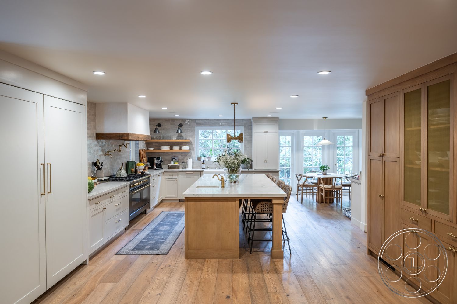 Americana 201 - neutral color palette, stainless steel appliances, textured wall treatments, white quartz countertop, pendant lighting fixtures, interior kitchen design, open-concept kitchen layout, minimalist kitchen decor, marble kitchen backsplash, hardwood kitchen floors, shaker-style kitchen cabinets, subtle recessed lighting, glass-front kitchen cabinets, natural wood open shelving, large kitchen island with seating, brushed gold cabinet hardware, light-filled dining area, modern farmhouse kitchen