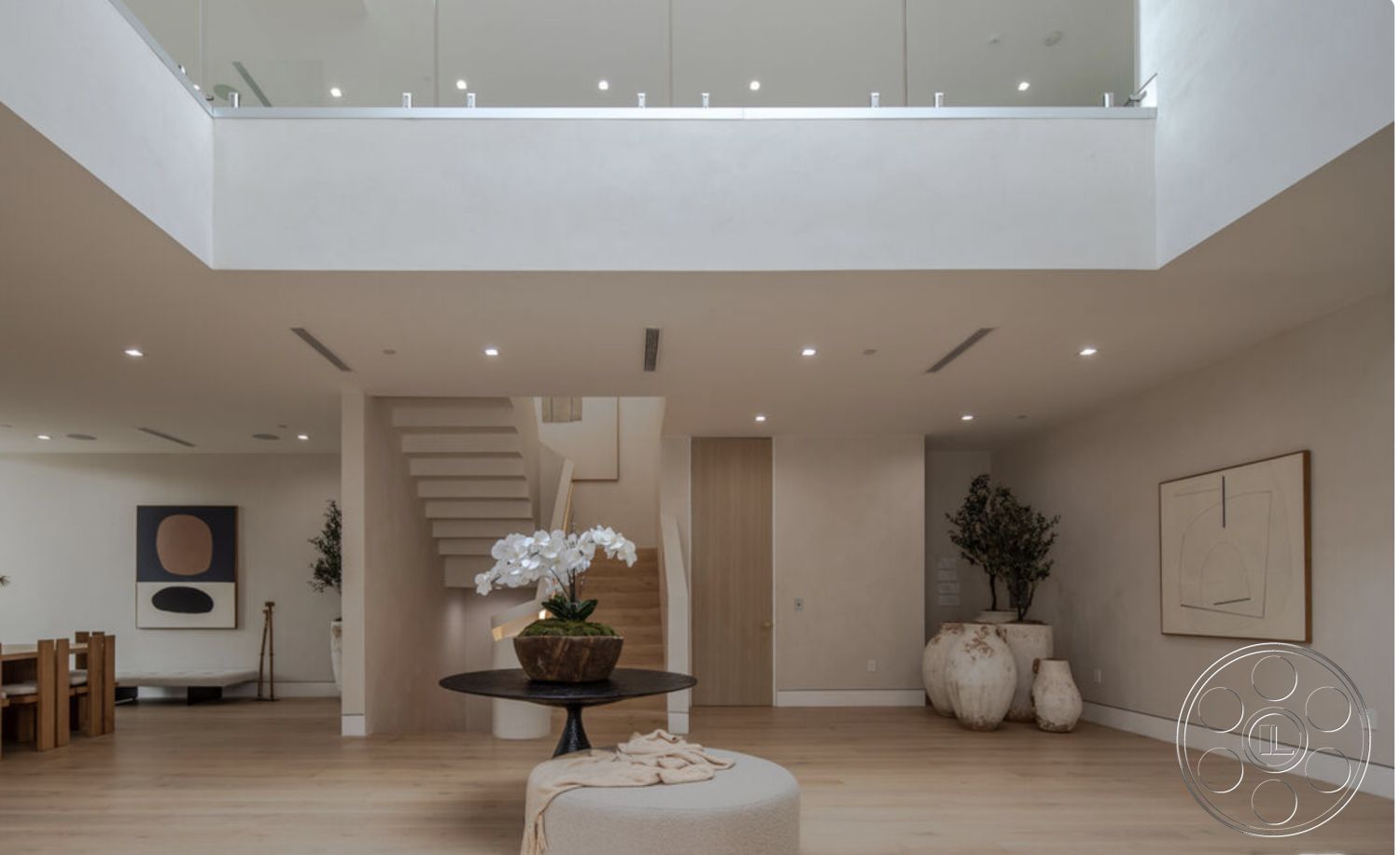 Modern 514 - contemporary furniture interior, neutral color palette interior, exposed wood ceiling beams interior, textured plaster walls interior, glass partition walls interior, open concept living space interior, modern art wall decor interior, floating stairs interior, light hardwood living room floors interior, vaulted living room ceiling interior, minimalist dining area with wooden table interior, large potted plants interior