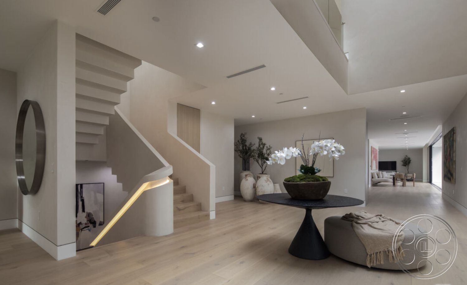 Modern 514 - interior recessed lighting, interior textured wall treatment, interior hardwood flooring, interior open concept living area, interior round coffee table, interior soft neutral color palette, interior large glass windows, interior minimalist design elements, interior floating staircase, interior seamless indoor-outdoor flow, interior potted orchid centerpiece, interior polished concrete walls, interior sleek furniture design, interior contemporary round mirror, interior decorative floor vase