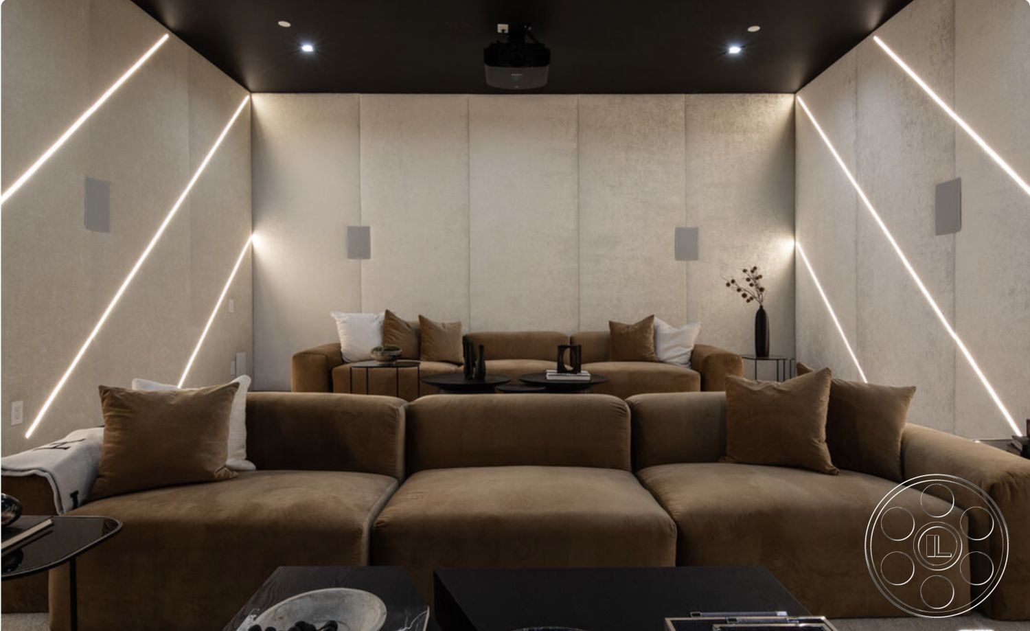 Modern 514 - interior textured wall panels, interior minimalist design, interior low-profile coffee table, interior plush fabric sectional sofa, interior recessed LED wall lighting, interior cozy movie room atmosphere, interior dark ceiling finish, interior angular wall design, interior soft throw pillows, interior decorative plant accents