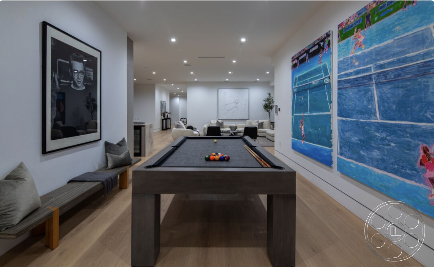 Modern 514 - neutral color palette, light hardwood flooring, open floor plan, minimalist furniture, floor-to-ceiling windows, large framed artwork, stylish sectional sofa, interior living room, white painted walls, decorative indoor plants, glass wall partition, recessed LED lighting, modern art wall decoration, modern concrete pool table, gray fabric throw pillows, contemporary side bench, spacious entertainment area