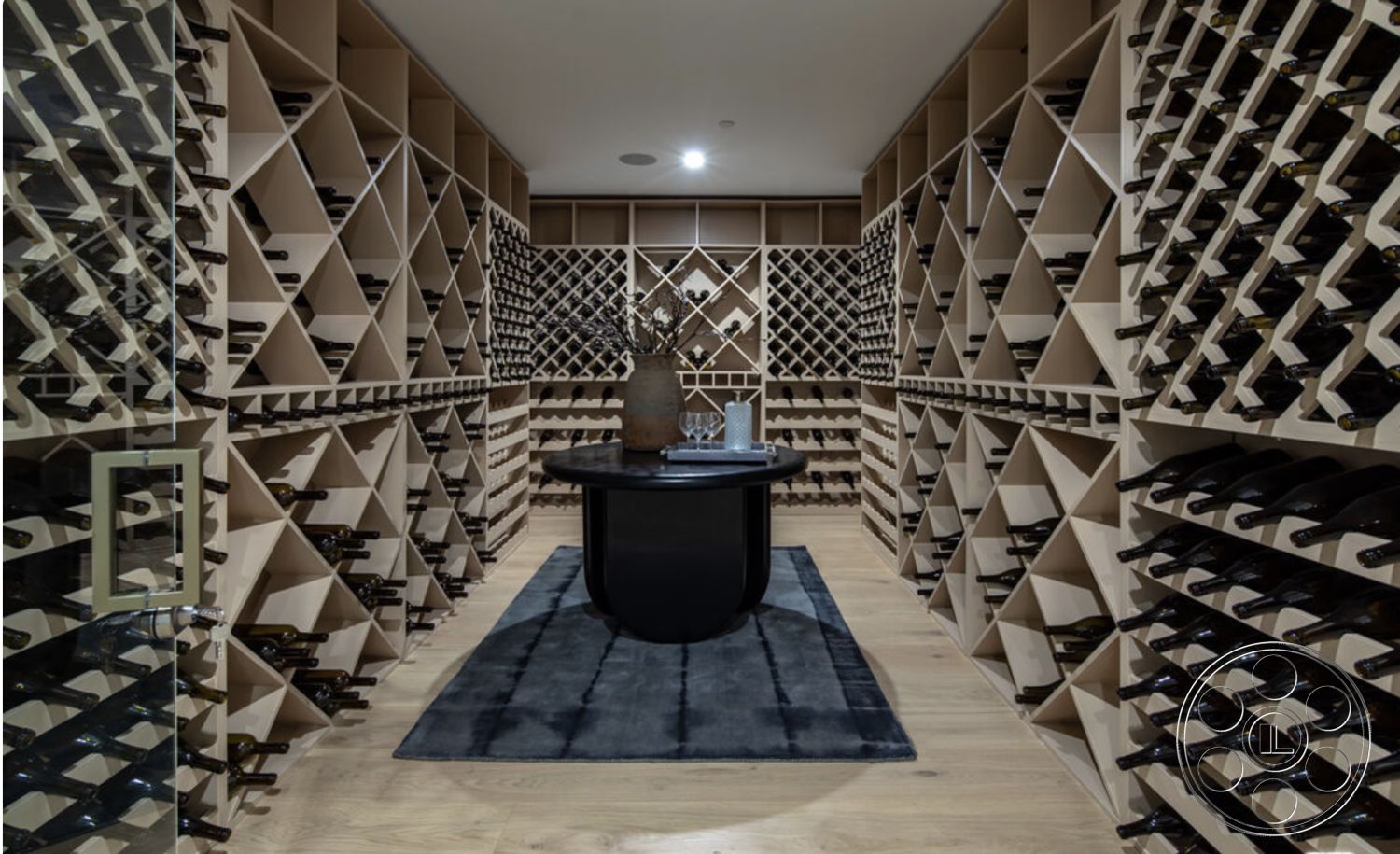 Modern 514 - textured area rug, dark hardwood flooring, ambient lighting fixtures, recessed ceiling lighting, modern minimalist design, built-in shelving units, natural wood accent walls, glass partition wall, interior wine cellar, custom wood wine racks, crosshatch wine storage, round black marble table, open layout wine storage