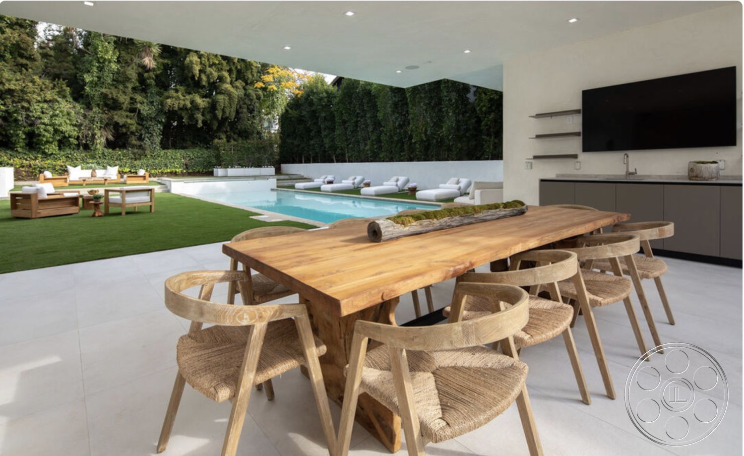 Modern 514 - neutral color palette, open layout, wood dining table, outdoor seating area, floor-to-ceiling windows, concrete wall, modern outdoor lighting, rectangular pool, lush greenery backdrop, outdoor entertainment space, woven dining chairs, contemporary architectural style, concrete patio flooring, minimalist design details, modern kitchen cabinetry, natural grass lawn, concrete pool border, exterior pool area, simple garden setting