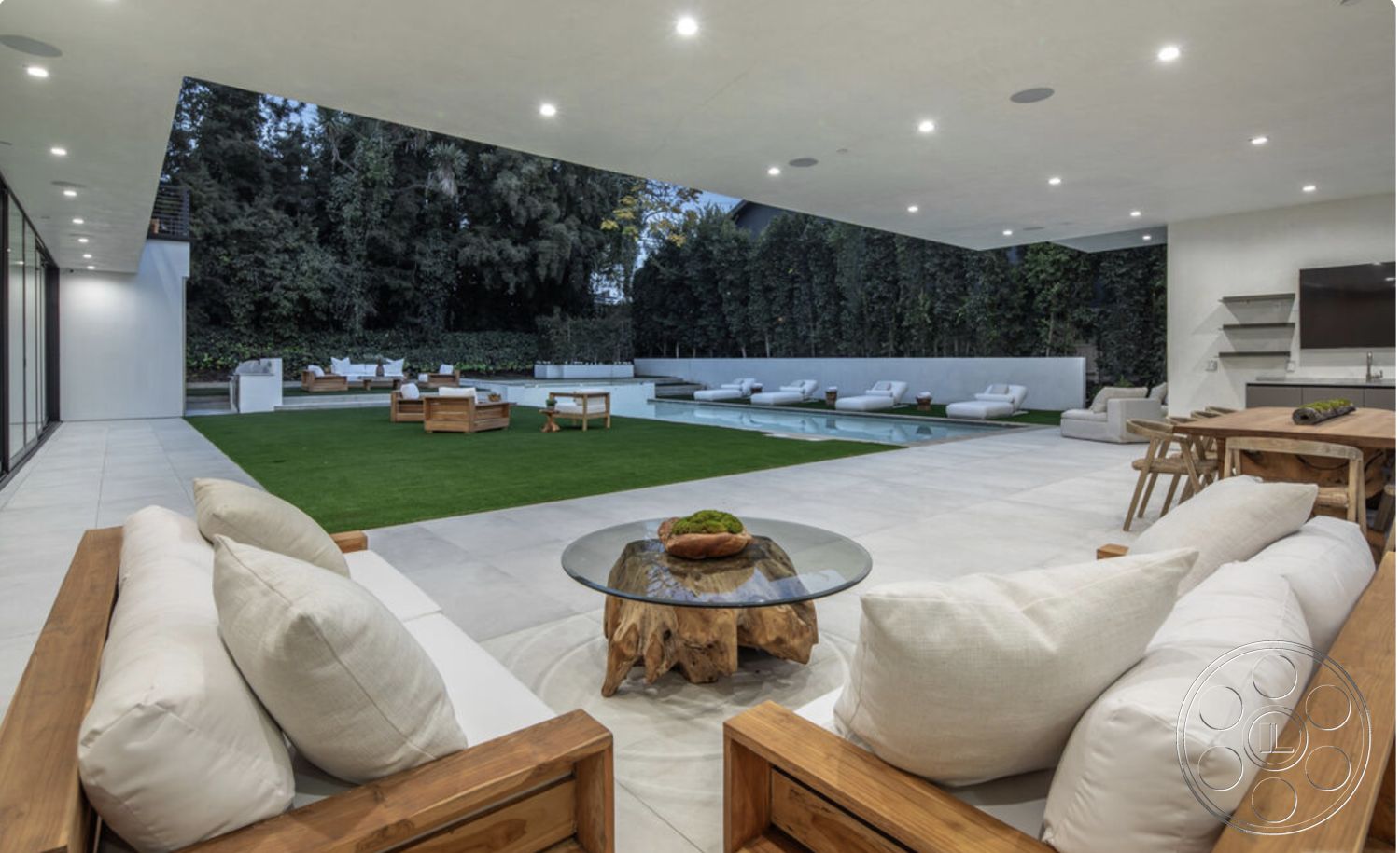 Modern 514 - minimalist design, glass sliding doors, rectangular swimming pool, stone coffee table, open-concept layout, exposed ceiling beams, modern lounge chairs, concrete patio flooring, urban garden setting, recessed LED lighting, wooden outdoor dining table, interior outdoor living space, cotton outdoor cushions, lush green turf lawn