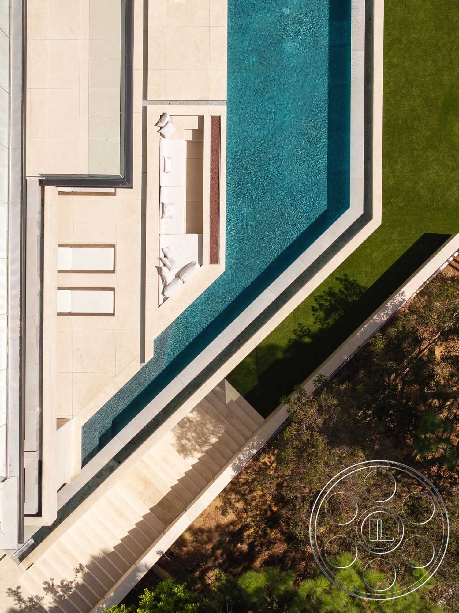 Modern 515 - surrounding greenery, outdoor lounge area, infinity pool, large floor-to-ceiling windows, rectangular pool, contemporary architectural style, exterior concrete pool border, modern minimalist design, stone patio flooring, metal railing details, geometric shapes in architecture, urban outdoor living space, built-in outdoor seating, concrete patio surface, landscaped lawn area, step staircase with concrete treads, white wall cladding, clear water pool surface, natural light enhancement, amenities for relaxation