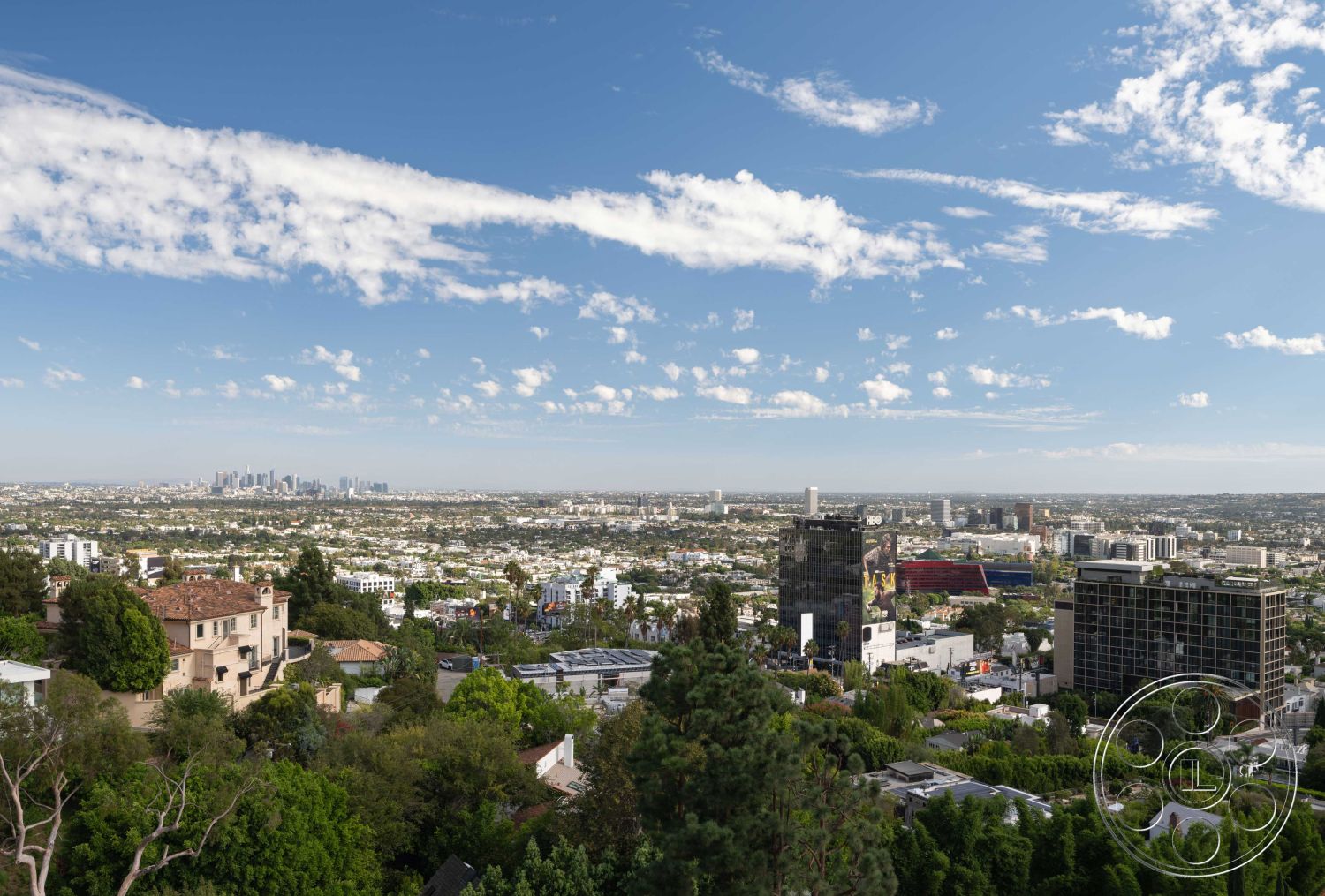 Modern 515 - floor-to-ceiling windows, natural stone pathways, flat roof design, contemporary architectural style, panoramic city skyline view, urban landscape view, hillside home exterior, eight-story residential building, brick accent walls on hillside homes, sloped terrain with landscaping, luxury home exterior finishes, lush green vegetation surrounding houses, spacious outdoor deck areas, modern urban neighborhood setting, medium-density residential area, modern multi-family buildings, balconies with glass railings, clean lines of modern architecture, diverse architectural styles in urban environment, mixed-use urban development