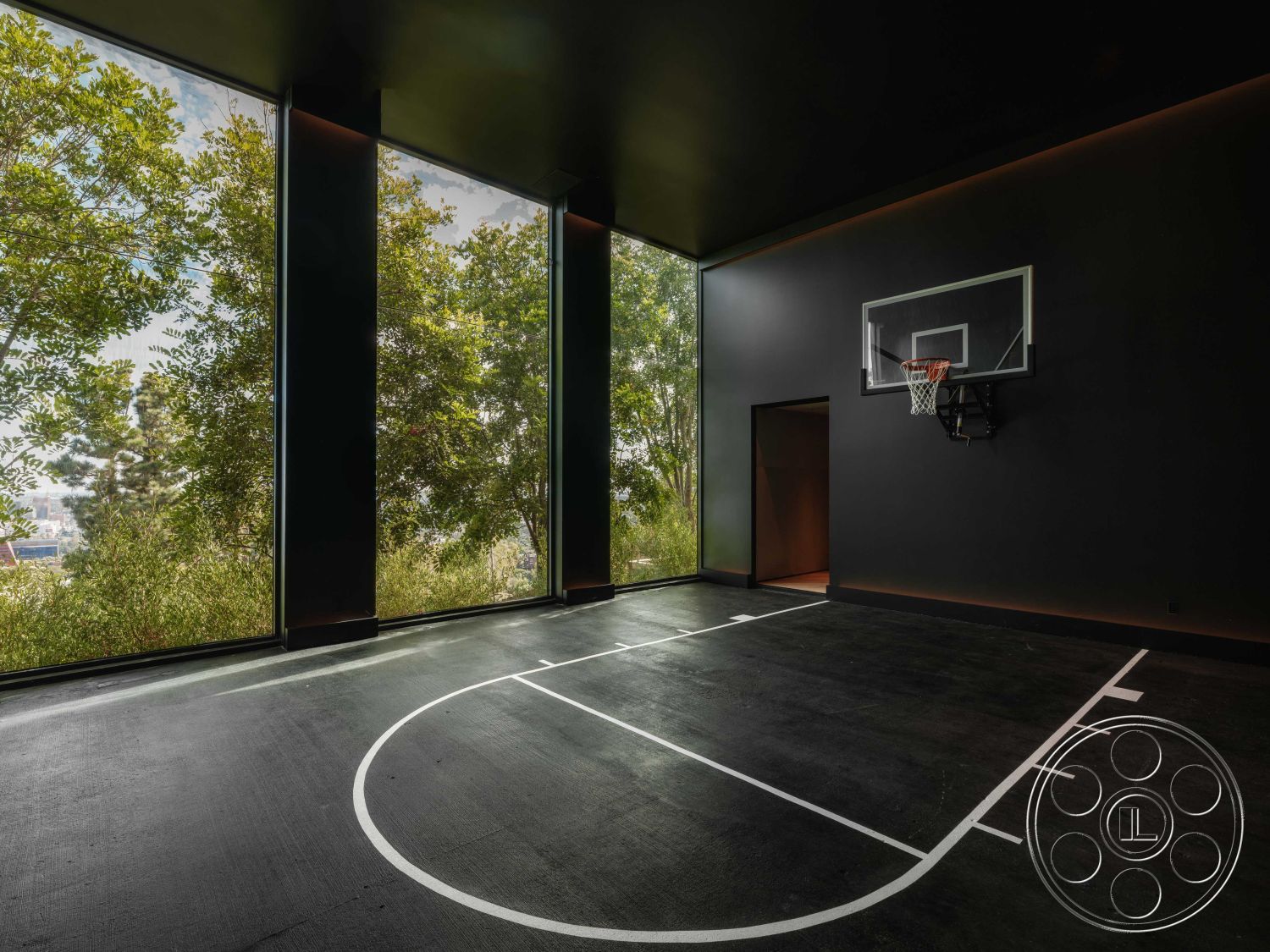 Modern 515 - modern architecture, minimalist design, vaulted ceiling, floor-to-ceiling glass windows, surrounding greenery view, open space with natural light, interior basketball court, black concrete flooring, dark wall treatment, indoor sports area