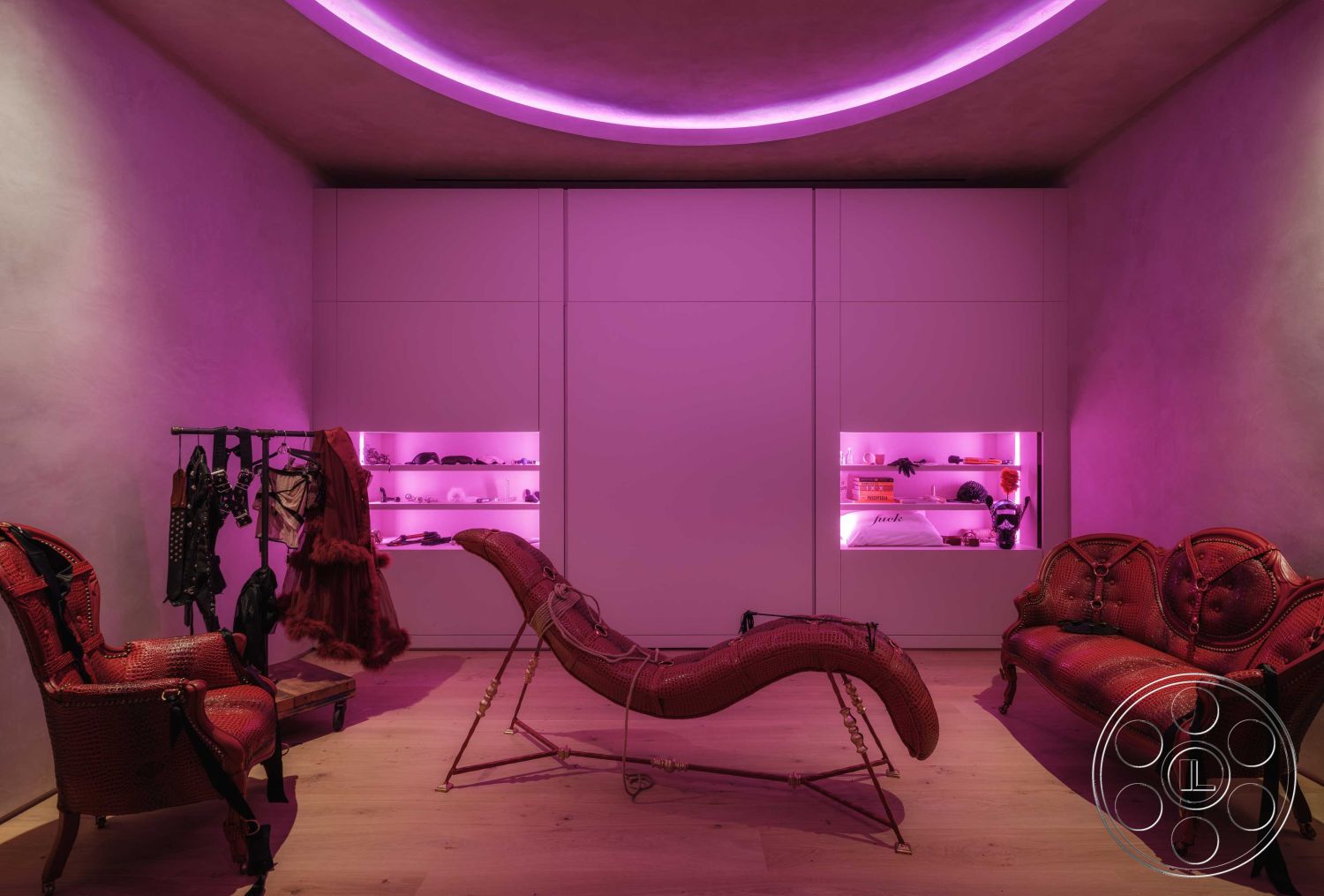 Modern 515 - wood flooring, textured plaster walls, contemporary art accents, modern lounge seating, curved ceiling with recessed LED lighting, exposed wood details, minimalist cabinetry with built-in lighting, colorful accent decor, artistic display shelving