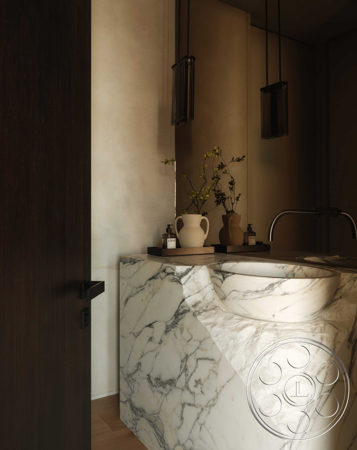 Modern 515 - interior modern pendant lighting, interior textured plaster walls, interior marble sink countertop, interior minimalist design, interior minimalistic decor, interior warm ambient lighting, interior polished marble vanity, interior dark wood door, interior decorative vases, interior stylish faucet