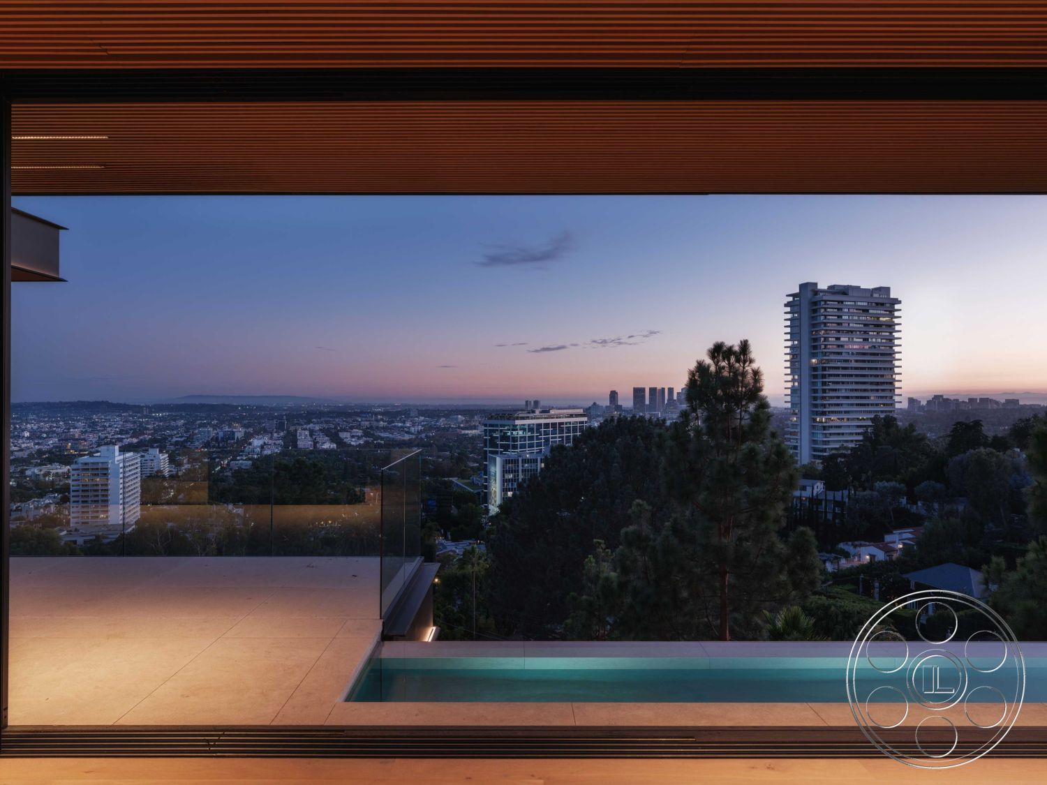 Modern 515 - landscaped garden, exterior view, floor-to-ceiling windows, outdoor living space, nighttime ambiance, modern architectural style, urban skyline view, luxury home design, concrete patio flooring, glass balcony railing, infinity pool edge, wooden ceiling slats, polished stone exterior walls, minimalist pool area