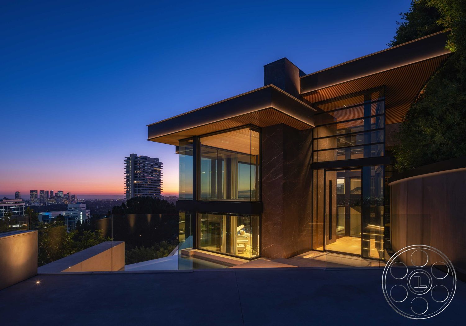 Modern 515 - exterior, modern architecture, minimalist design, landscaped surroundings, floor-to-ceiling windows, glass facade, city skyline view, elevated location, concrete patio floor, steel structural elements, black stone exterior walls, open outdoor living space, wood paneling roof details, curved exterior shape, LED accent lighting, spacious balcony area