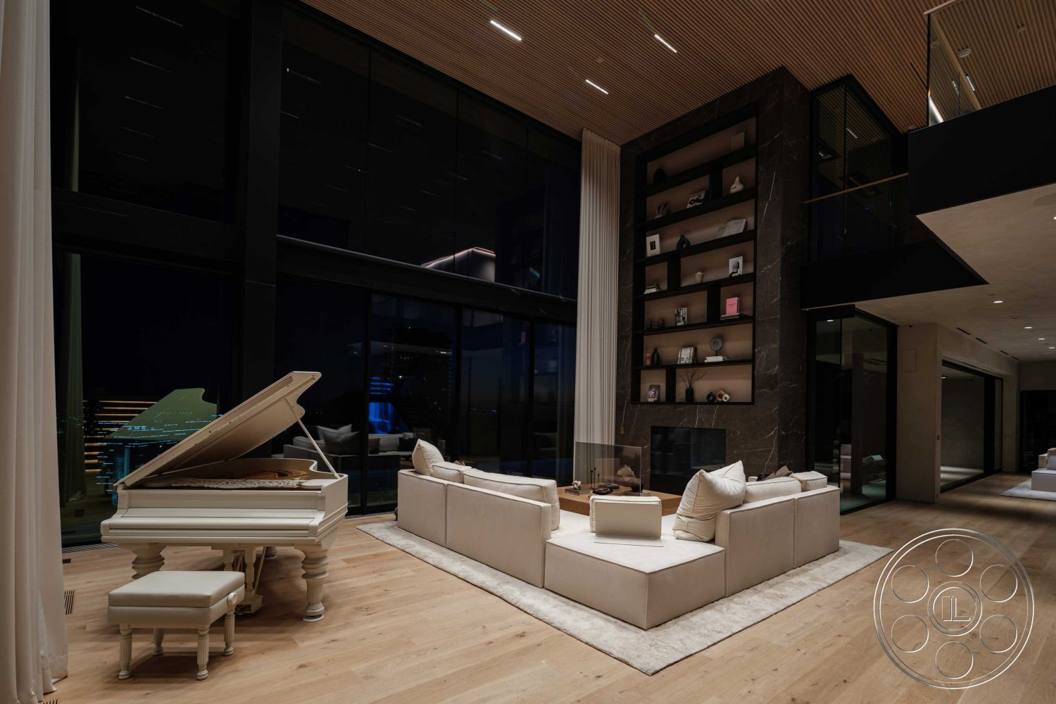 Modern 515 - interior neutral color palette, interior recessed lighting, interior minimalist decor, interior hardwood living room floors, interior floor-to-ceiling windows, interior open concept layout, interior plush area rug, interior glass partition wall, interior dark stone fireplace wall, interior white fabric sectional sofa, interior light wood ceiling details, interior contemporary bookshelf design, interior modern grand piano, interior decorative accents, interior elegant curtains