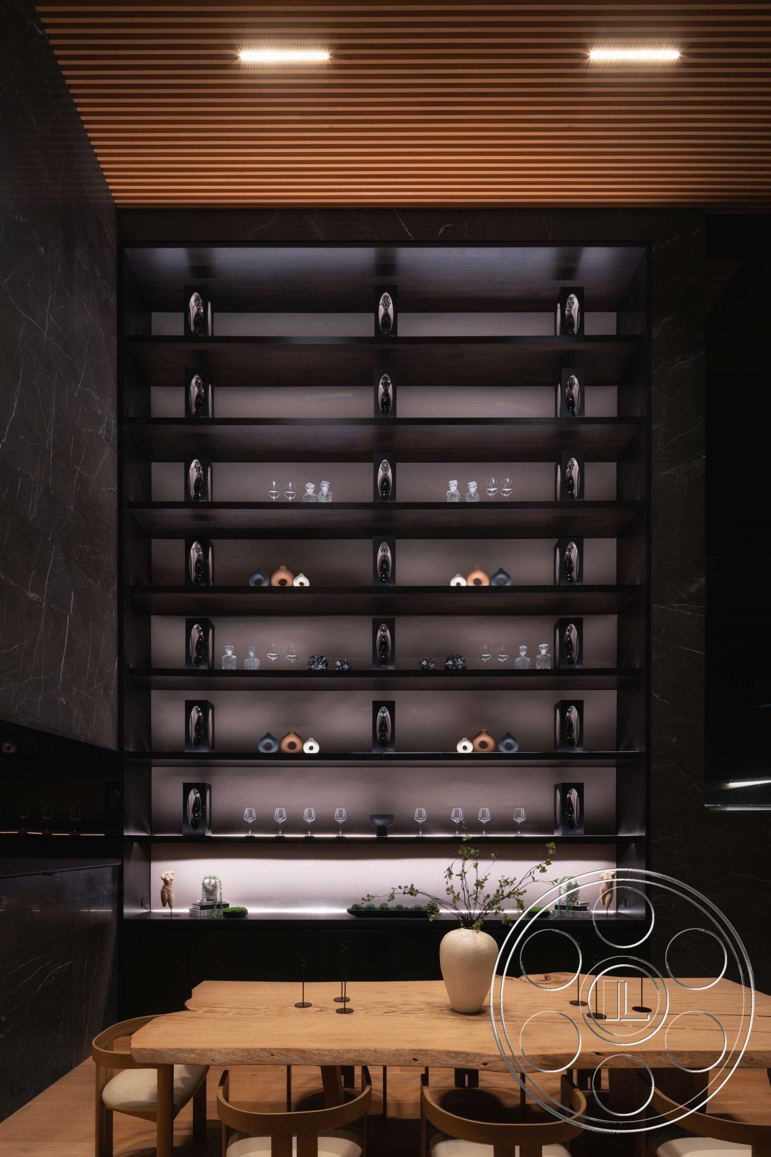 Modern 515 - interior soft ambient lighting, interior monochromatic color scheme, interior black marble accent wall, interior modern design aesthetics, interior wooden ceiling with slats, interior black shelving units with backlighting, interior natural wood dining table, interior round wooden dining chairs, interior glassware display on shelves, interior minimalist decor with vases, interior sleek storage cabinets