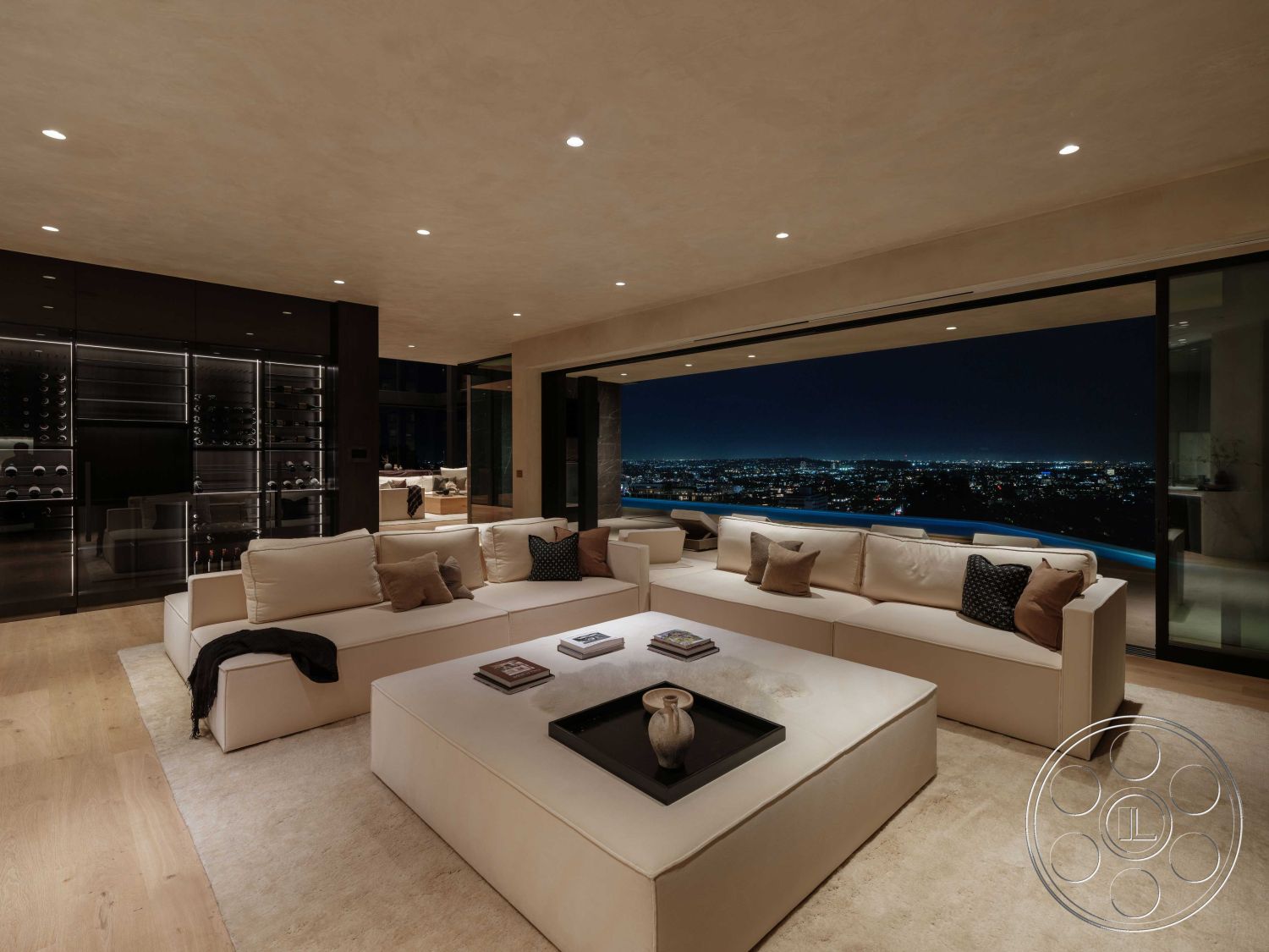 Modern 515 - hardwood flooring, open concept design, soft area rug, city skyline view, minimalist coffee table, textured wall treatment, decorative throw pillows, floor-to-ceiling glass windows, ambient recessed lighting, contemporary sectional sofa, interior modern living room, plastered ceiling finish, neutral colored upholstery, black metal wine cellar