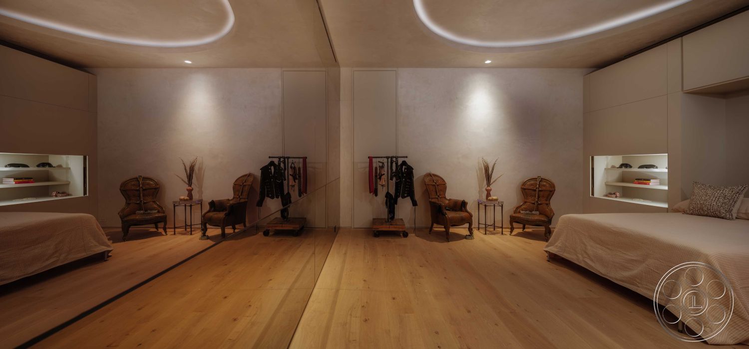 Modern 515 - neutral color palette, stylish decor accents, minimalist design, contemporary furniture, open space layout, modern interior, soft ambient lighting, built-in shelves, textured ceiling details, hardwood bedroom floors, smooth plaster walls, seating area with accent chairs, integrated closet space