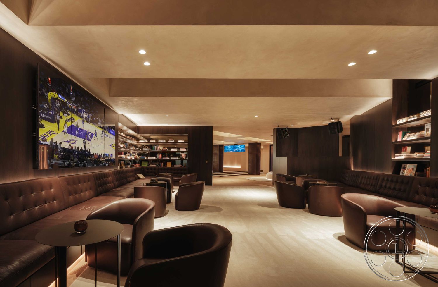 Modern 515 - open floor plan, textured wall finish, dark wood paneling, comfortable seating arrangement, tan wall color, cozy gathering area, minimalist decor elements, interior lounge space, polished hardwood flooring, soft recessed lighting, plaster ceiling treatment, upholstered leather seating, built-in bookshelf units, contemporary coffee tables, floating media console, modern entertainment area, luxury basement design, flat-screen television wall, elegant lounge atmosphere, custom cabinetry design