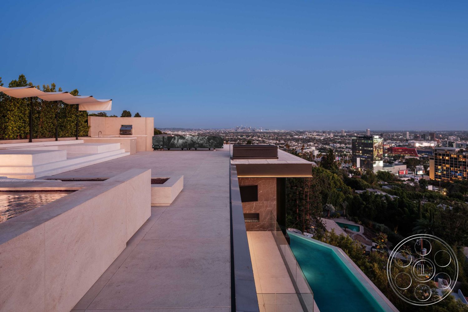 Modern 515 - exterior concrete patio floor, interior vaulted ceiling, interior floor-to-ceiling windows, interior open concept living area, architectural detail cantilevered roof, exterior minimalist pool design, exterior infinity edge pool, exterior horizontal wood slat privacy screen, exterior glass pool fencing, exterior stucco home facade, interior large format tile flooring, interior modern outdoor seating area, exterior panoramic city skyline view, exterior spacious outdoor entertainment area, architectural style contemporary, surrounding setting hillside location