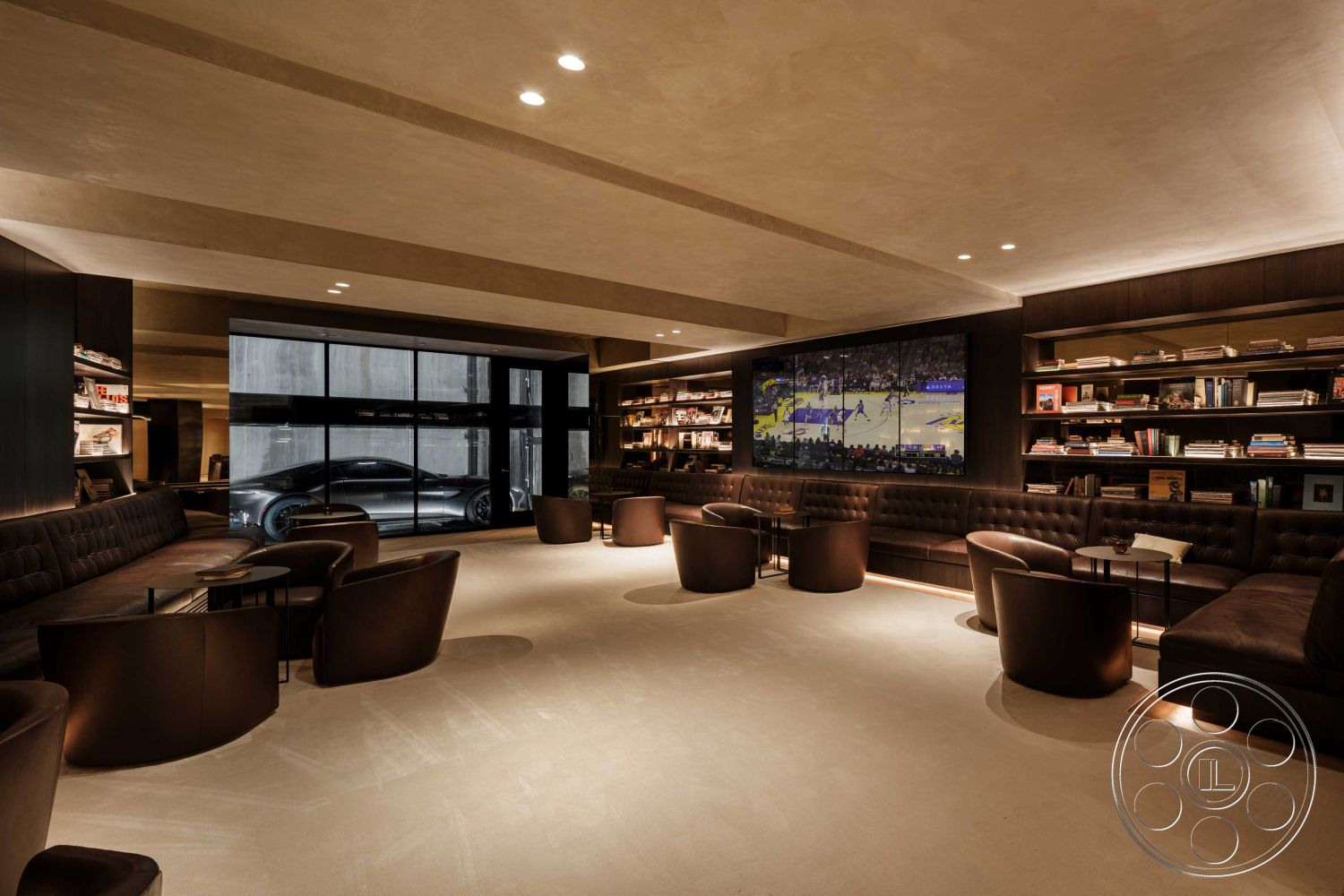 Modern 515 - textured plaster walls, plush seating area, open-concept design, dark wood shelving, floor-to-ceiling glass windows, concrete floor finish, modern recessed lighting, interior lounge area, warm neutral color palette, tufted leather sofa seating, black metal accent tables, built-in bookcases, designated media wall, luxurious lounge environment, minimalist architectural elements