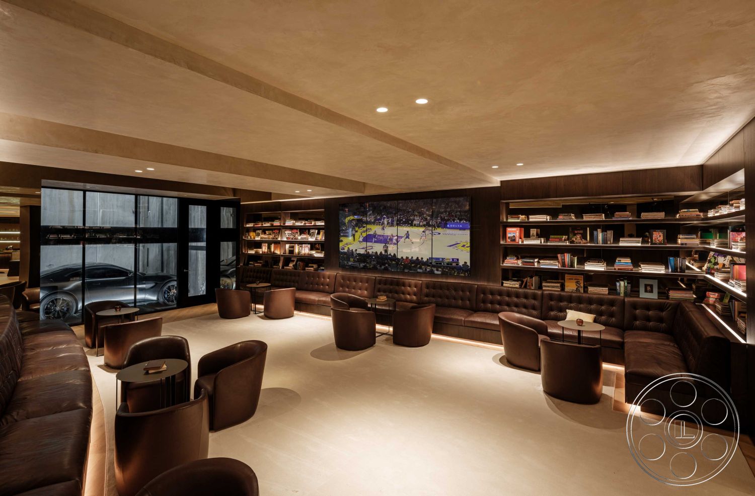 Modern 515 - stone accent wall, wall-mounted television, open floor plan, large glass windows, warm color palette, cozy reading nook, dark wood shelving, leather sectional sofa, recessed LED lighting, modern seating arrangement, textured ceiling panels, interior lounge, contemporary coffee tables, natural wood bookshelves, plastered wall finish, industrial-style glass door, luxury vehicle view