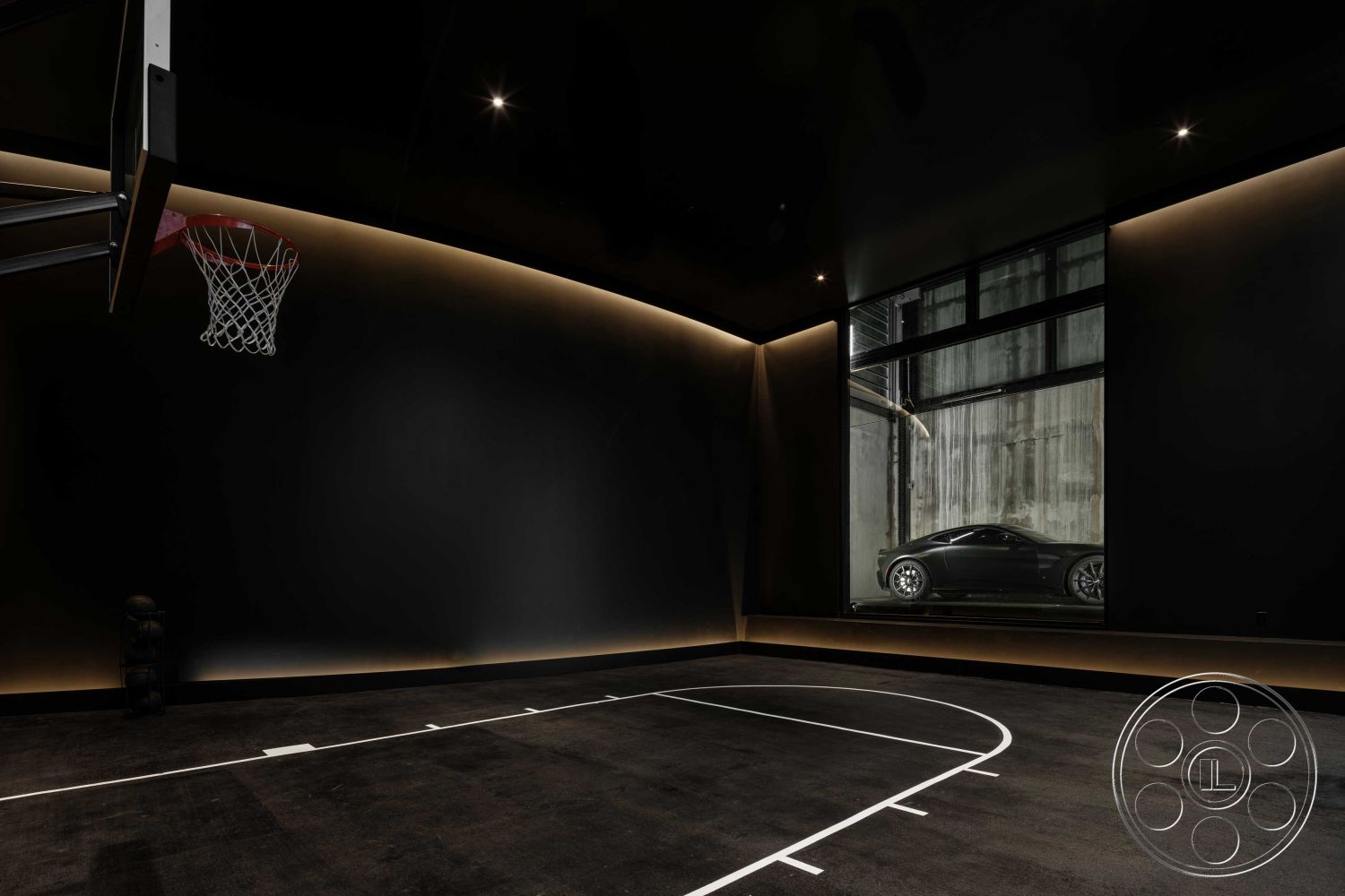 Modern 515 - minimalist design, concrete floor, open space concept, large glass window, ambient LED lighting, modern industrial style, smooth plaster ceiling, interior basketball court, black acoustical walls, professional indoor basketball hoop, white basketball court lines, luxury sports feature, built-in car display area