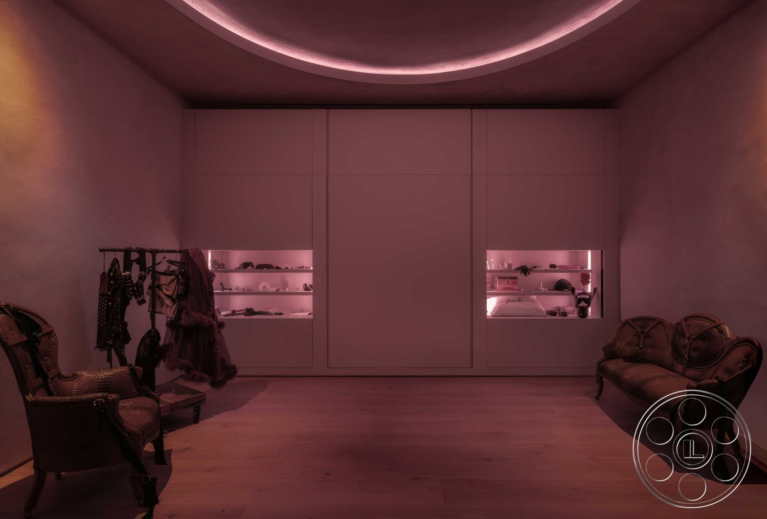 Modern 515 - neutral color palette, cozy seating area, open space layout, soft ambient lighting, artistic design elements, textured wall treatments, contemporary interior style, wooden floorboards, built-in shelving units, plastered wall finishes, modern decorative accents, minimalist closet design, sofa with intricate detailing, dressing area lighting, circular ceiling detail, elegant vintage furniture, stylish clothing rack