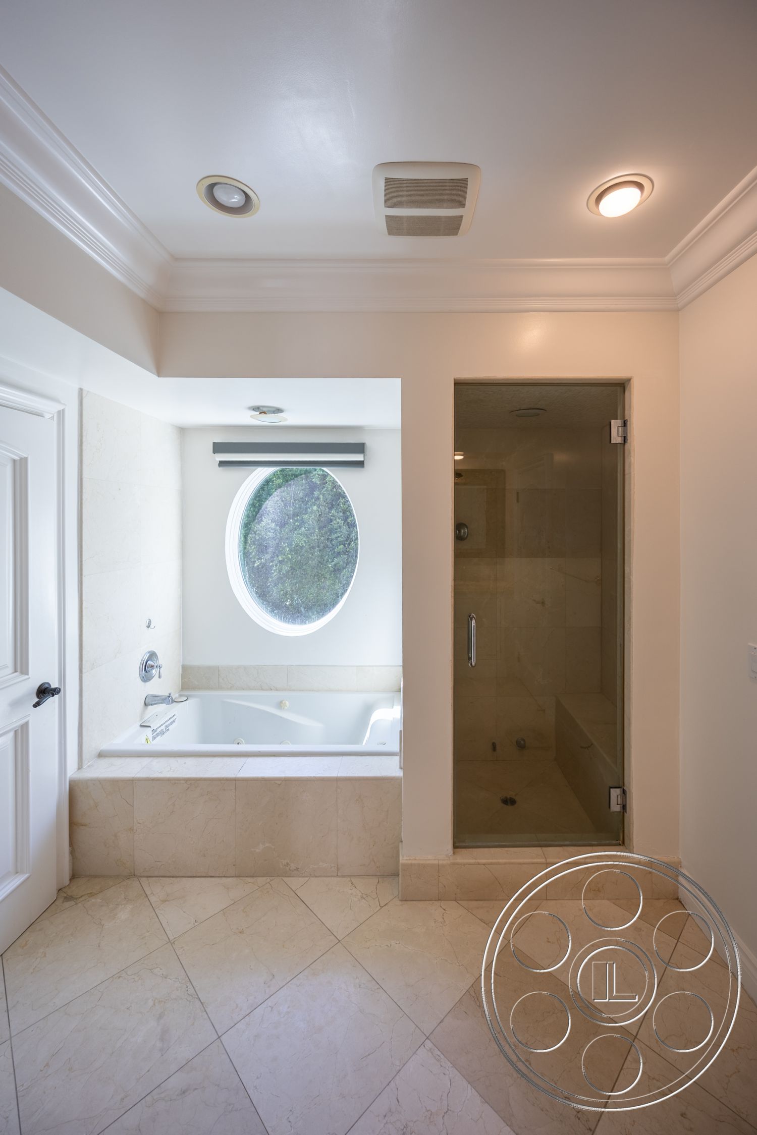 Americana 431 - interior white painted walls, interior recessed lighting fixtures, interior glass shower doors, interior marble bathroom flooring, interior crown molding details, interior tile shower enclosure, interior circular window feature, interior round bathtub design, interior cream marble tub surround, interior light-colored ceramic tile, interior minimalist design approach, interior angled wall layout, interior contemporary bathroom style