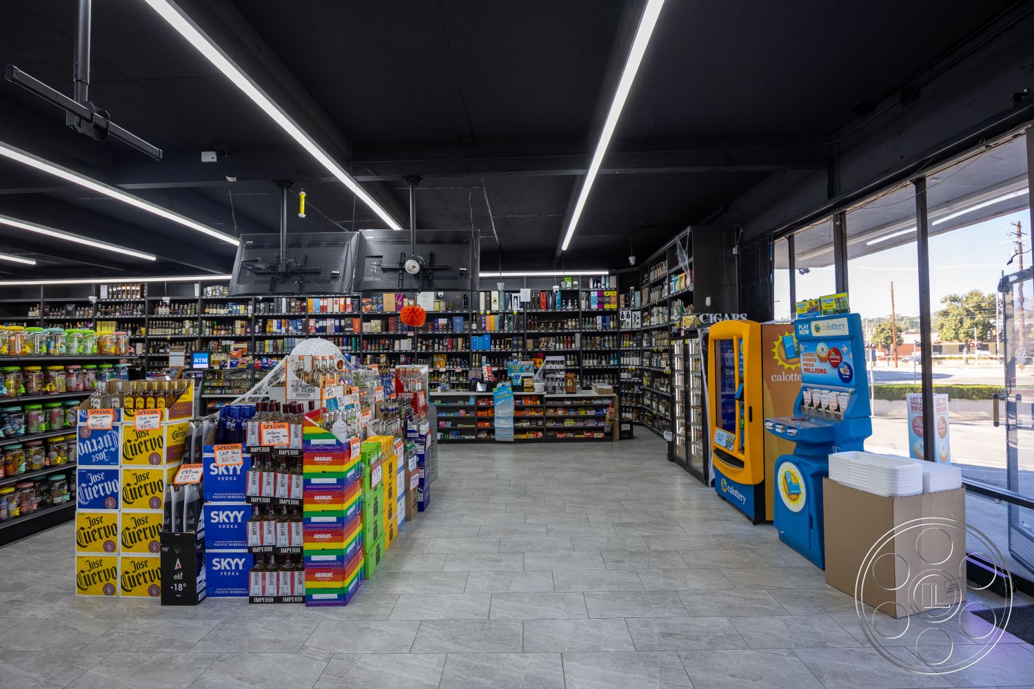 Shop 127 - interior space, metal shelving units, floor-to-ceiling windows, glass display cases, open floor layout, ambient LED ceiling lighting, colorful product packaging, polished porcelain tile flooring, dark painted ceiling, merchandise display signage, convenience store setup, refrigerated beverage coolers, checkout counter area, urban convenience store, self-service kiosk, spacious aisles, strategically placed promotional displays, cooler door handles, cash register area, customer service point