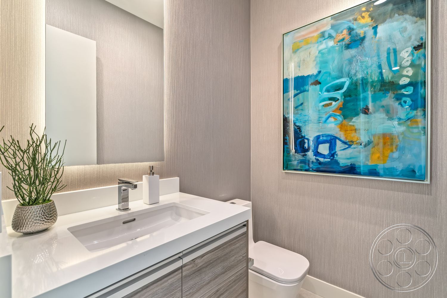 Palm Springs 109 - neutral color palette, minimalist design, light wood cabinetry, soft ambient lighting, white quartz countertop, interior bathroom, textured wallpaper accent wall, decorative potted plant, white tile flooring, glass mirror with backlighting, modern sink faucet, stylish vessel sink, framed contemporary artwork