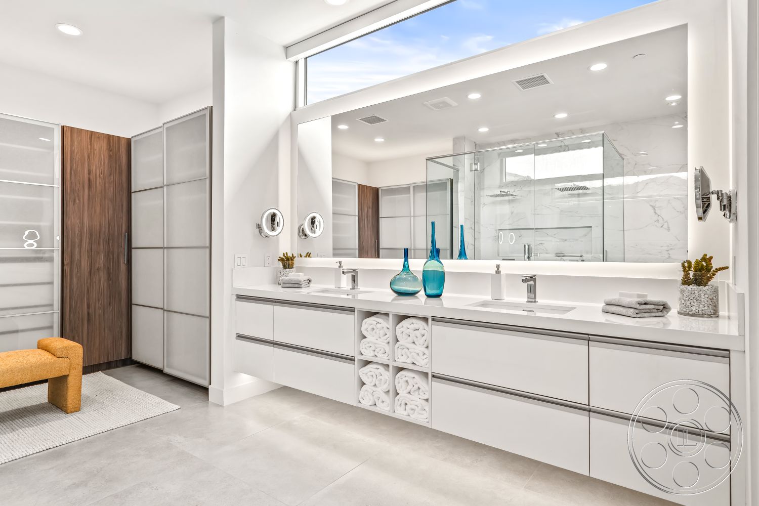 Palm Springs 109 - interior floor-to-ceiling windows, interior white painted walls, interior glass shower enclosure, interior minimalist aesthetic, interior marble bathroom flooring, interior modern light fixtures, interior open layout design, interior modern vanity with quartz countertop, interior wood paneling bathroom door, interior polished chrome faucet, interior minimalist design features, interior stone accent walls in shower, interior rectangular mirror with LED lighting, interior soft area rug under seating, interior seamless glass partitions, interior built-in storage for towels, interior sleek cabinet handles, interior natural plant accents