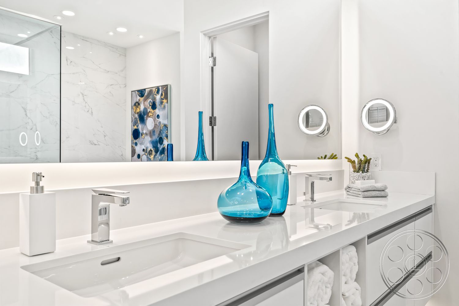 Palm Springs 109 - interior recessed ceiling lights, interior marble bathroom walls, interior glass shower enclosure, interior chrome faucet fixtures, interior textured wall art, interior quartz bathroom countertop, interior white cabinetry, interior LED vanity lighting, interior blue decorative vases, interior round vanity mirror, interior white towel storage, interior clean modern design