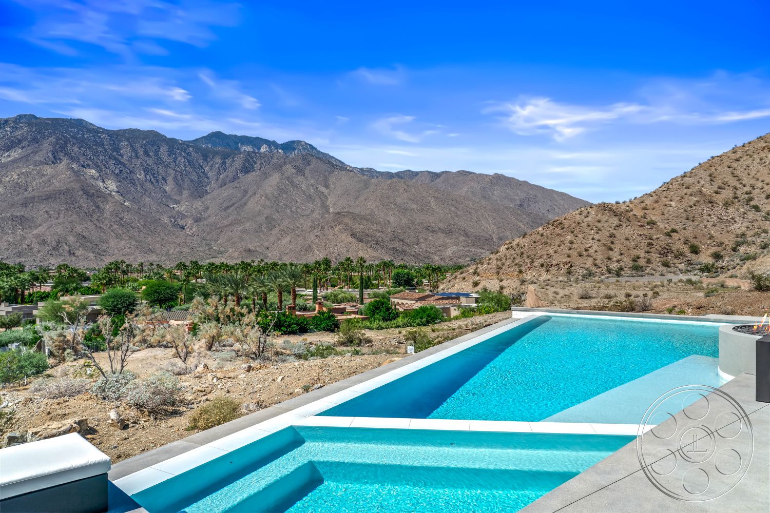 Palm Springs 109 - exterior, natural stone elements, rectangular swimming pool, outdoor lounge area, modern architectural style, mountain view, desert landscaping, infinity pool, landscaped garden area, stone patio flooring, concrete pool coping, desert home, surrounding mountain landscape, hardscaped outdoor area, spa pool feature