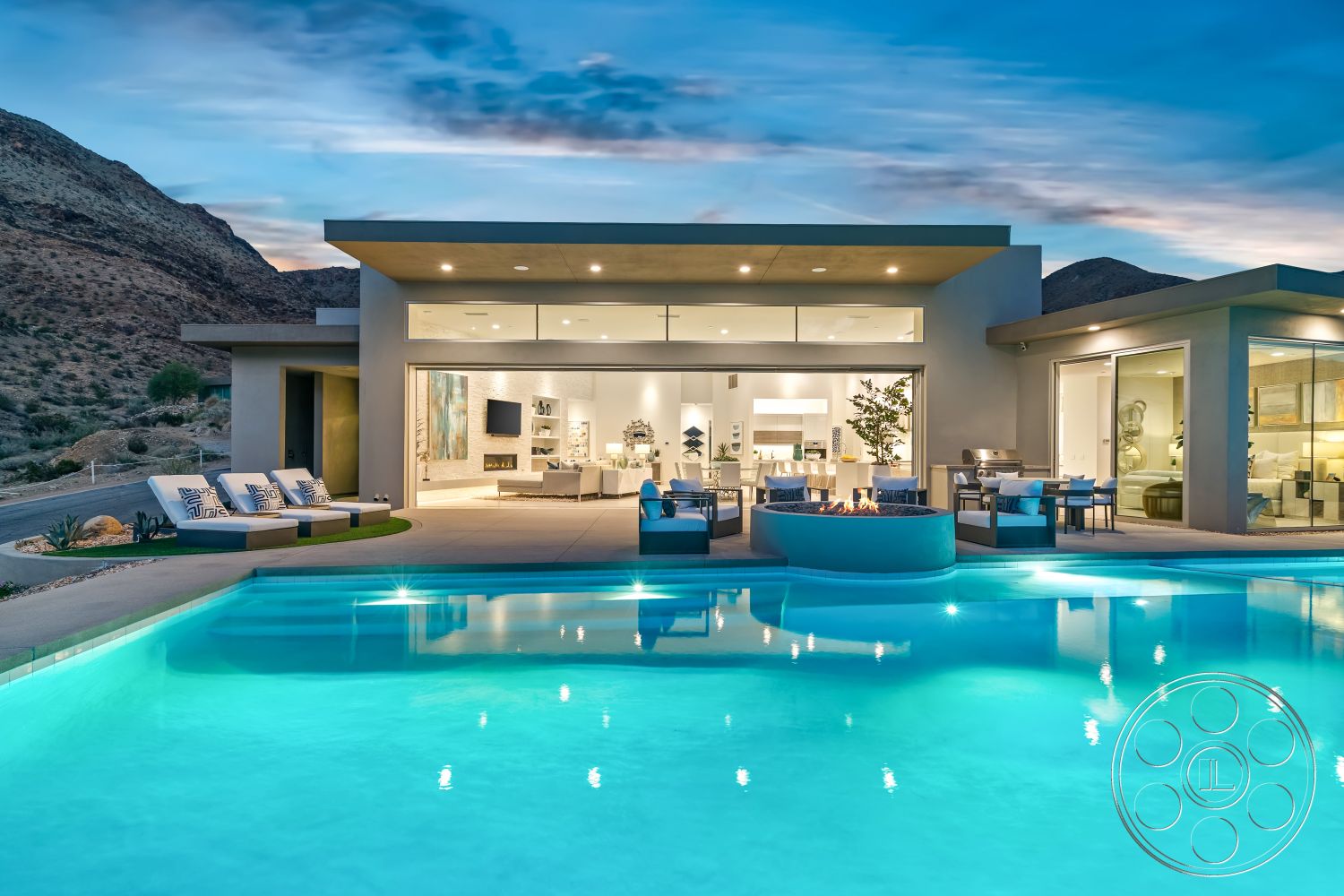 Palm Springs 109 - landscaped garden, natural stone accents, exposed concrete walls, outdoor dining area, vaulted ceiling, open-concept living space, urban retreat, rectangular pool, stone fire pit, wooden lounge chairs, modern outdoor lounge area, curved pool edge, glass partition walls, floor-to-ceiling glass windows, minimalist architectural style, concrete patio floor, desert home setting