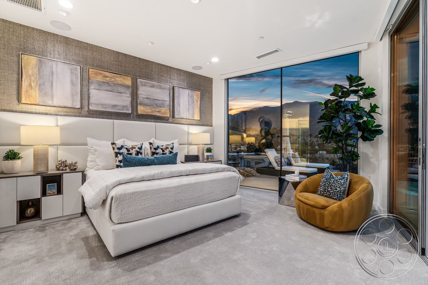 Palm Springs 109 - neutral color palette, large floor-to-ceiling windows, decorative throw pillows, orange accent chair, modern bedside lamps, glass sliding door, mountain view setting, interior bedroom, minimalist nightstand, textured wallpaper accent wall, indoor potted plant, contemporary art pieces, carpet bedroom flooring, white upholstered bed frame