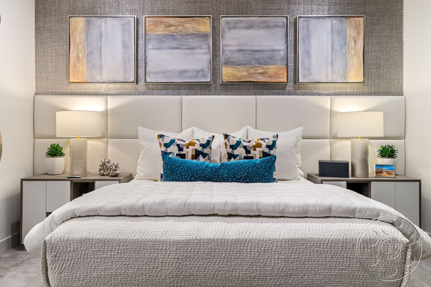 Palm Springs 109 - neutral color palette, contemporary style, minimalist design, abstract wall art, white quilted bedding, interior bedroom, textured wallpaper accent wall, soft carpet flooring, decorative throw pillows with geometric patterns, upholstered bed headboard, modern side tables, table lamps with textured bases, potted greenery decor